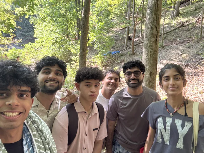 Group selfie with friends on a hike in the woods