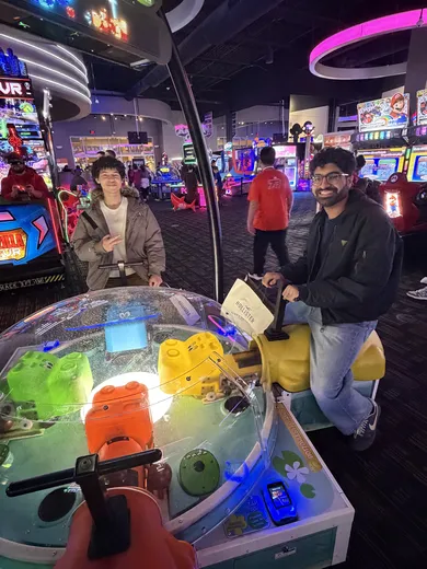 Friends at a giant Hungry Hungry Hippos arcade game