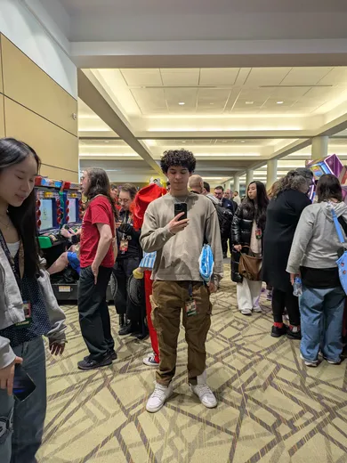Jared standing in the rhythm game area at PAX East